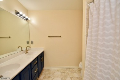 This 3-bedroom, 3-bath end-unit townhome isn't just a place to on Minerals Golf Club in New Jersey - for sale on GolfHomes.com, golf home, golf lot