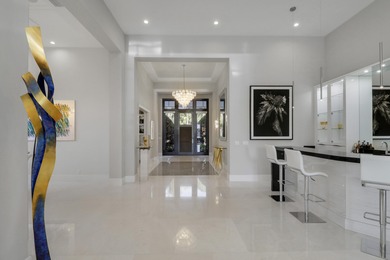 Spectacular 1-story residence by Mustapick Homes on a .39 acre on Old Palm Golf Club in Florida - for sale on GolfHomes.com, golf home, golf lot