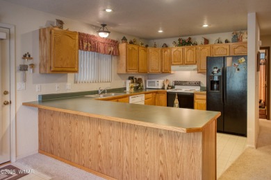 Tucked beneath towering pines in the heart of Pinetop Country on Pinetop Lakes Golf and Country Club in Arizona - for sale on GolfHomes.com, golf home, golf lot