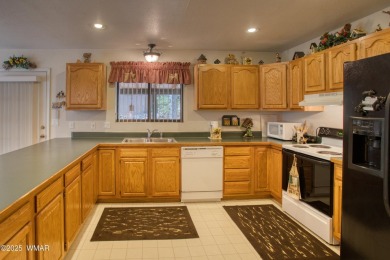 Tucked beneath towering pines in the heart of Pinetop Country on Pinetop Lakes Golf and Country Club in Arizona - for sale on GolfHomes.com, golf home, golf lot
