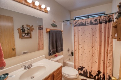Tucked beneath towering pines in the heart of Pinetop Country on Pinetop Lakes Golf and Country Club in Arizona - for sale on GolfHomes.com, golf home, golf lot