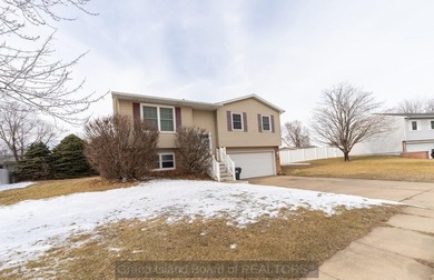 Welcome home to this beautiful 4-bedroom, 2-bath property on Indianhead Golf Club in Nebraska - for sale on GolfHomes.com, golf home, golf lot