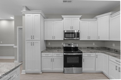 This NEW CONSTRUCTION, single level CRAFTSMAN style home is on Oyster Bay Golf Links in North Carolina - for sale on GolfHomes.com, golf home, golf lot