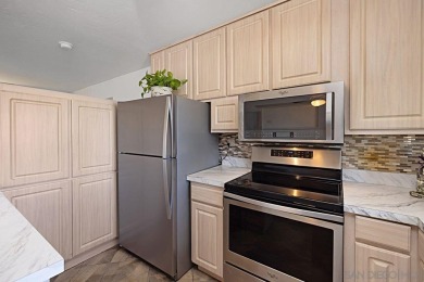 Discover this beautiful Top-Floor End Unit in the heart of San on Mission Trails Golf Course in California - for sale on GolfHomes.com, golf home, golf lot