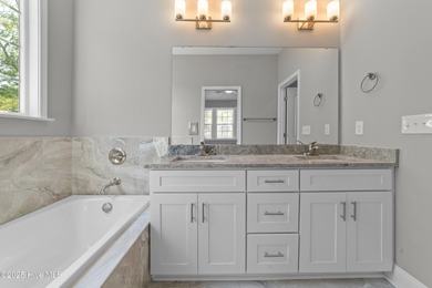 This NEW CONSTRUCTION, single level CRAFTSMAN style home is on Oyster Bay Golf Links in North Carolina - for sale on GolfHomes.com, golf home, golf lot