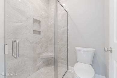 This NEW CONSTRUCTION, single level CRAFTSMAN style home is on Oyster Bay Golf Links in North Carolina - for sale on GolfHomes.com, golf home, golf lot