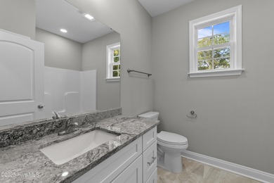 This NEW CONSTRUCTION, single level CRAFTSMAN style home is on Oyster Bay Golf Links in North Carolina - for sale on GolfHomes.com, golf home, golf lot