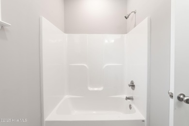 This NEW CONSTRUCTION, single level CRAFTSMAN style home is on Oyster Bay Golf Links in North Carolina - for sale on GolfHomes.com, golf home, golf lot