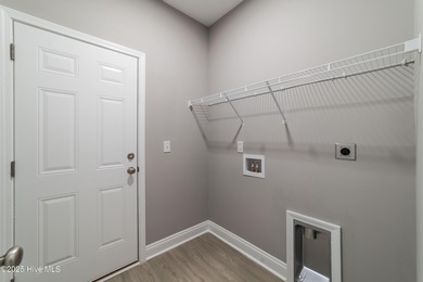 This NEW CONSTRUCTION, single level CRAFTSMAN style home is on Oyster Bay Golf Links in North Carolina - for sale on GolfHomes.com, golf home, golf lot