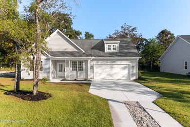 This NEW CONSTRUCTION, single level CRAFTSMAN style home is on Oyster Bay Golf Links in North Carolina - for sale on GolfHomes.com, golf home, golf lot