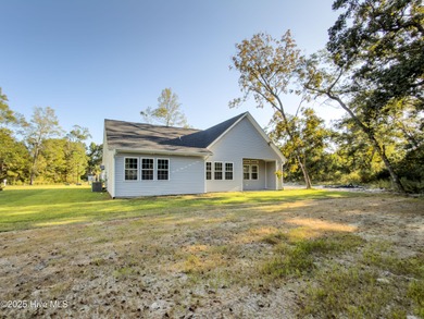 This NEW CONSTRUCTION, single level CRAFTSMAN style home is on Oyster Bay Golf Links in North Carolina - for sale on GolfHomes.com, golf home, golf lot