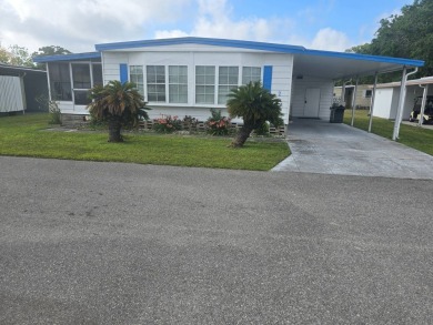 OWNER WILL CONSIDER FINANCING OPTION! Palm trees line the front on Grasslands Golf and Country Club in Florida - for sale on GolfHomes.com, golf home, golf lot