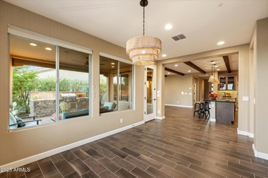 Set on an elevated premium lot capturing sweeping views of Four on Vista Verde Golf Course in Arizona - for sale on GolfHomes.com, golf home, golf lot