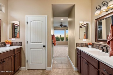 Set on an elevated premium lot capturing sweeping views of Four on Vista Verde Golf Course in Arizona - for sale on GolfHomes.com, golf home, golf lot
