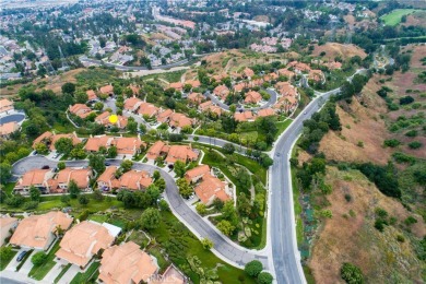 A wonderful home nestled high in the hills of Anaheim surrounded on Anaheim Hills Golf Course in California - for sale on GolfHomes.com, golf home, golf lot