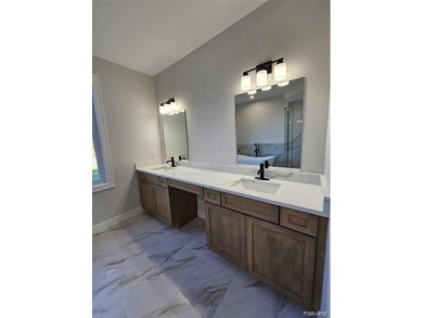 Ready to move in - includes the irrigation system, sod, and on St Clair River Country Club in Michigan - for sale on GolfHomes.com, golf home, golf lot