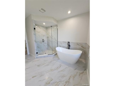 Ready to move in - includes the irrigation system, sod, and on St Clair River Country Club in Michigan - for sale on GolfHomes.com, golf home, golf lot