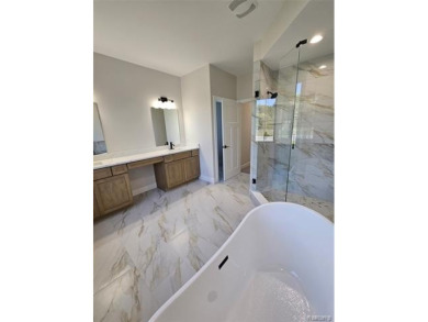 Ready to move in - includes the irrigation system, sod, and on St Clair River Country Club in Michigan - for sale on GolfHomes.com, golf home, golf lot