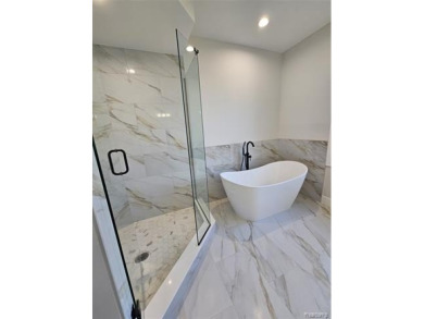 Ready to move in - includes the irrigation system, sod, and on St Clair River Country Club in Michigan - for sale on GolfHomes.com, golf home, golf lot