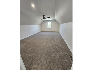 Ready to move in - includes the irrigation system, sod, and on St Clair River Country Club in Michigan - for sale on GolfHomes.com, golf home, golf lot