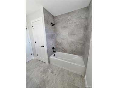 Ready to move in - includes the irrigation system, sod, and on St Clair River Country Club in Michigan - for sale on GolfHomes.com, golf home, golf lot