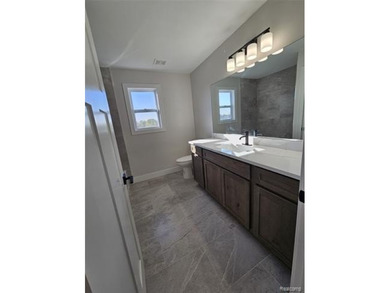 Ready to move in - includes the irrigation system, sod, and on St Clair River Country Club in Michigan - for sale on GolfHomes.com, golf home, golf lot