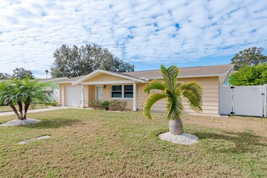 This move-in ready home is perfectly situated between vibrant on The Dunedin Country Club in Florida - for sale on GolfHomes.com, golf home, golf lot