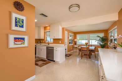 This move-in ready home is perfectly situated between vibrant on The Dunedin Country Club in Florida - for sale on GolfHomes.com, golf home, golf lot