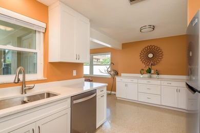 This move-in ready home is perfectly situated between vibrant on The Dunedin Country Club in Florida - for sale on GolfHomes.com, golf home, golf lot