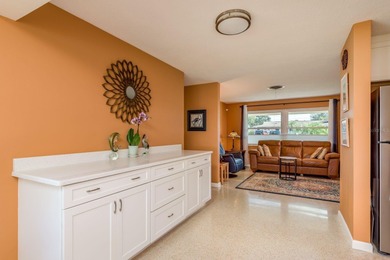 This move-in ready home is perfectly situated between vibrant on The Dunedin Country Club in Florida - for sale on GolfHomes.com, golf home, golf lot