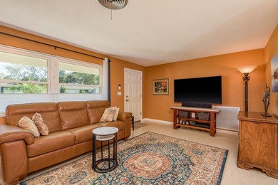 This move-in ready home is perfectly situated between vibrant on The Dunedin Country Club in Florida - for sale on GolfHomes.com, golf home, golf lot