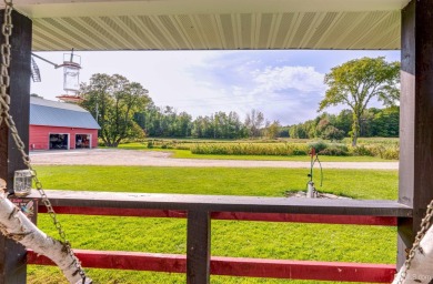 This picture perfect farmhouse sits nestled in the fields at the on Hiawatha Sportsmans Golf Club in Michigan - for sale on GolfHomes.com, golf home, golf lot