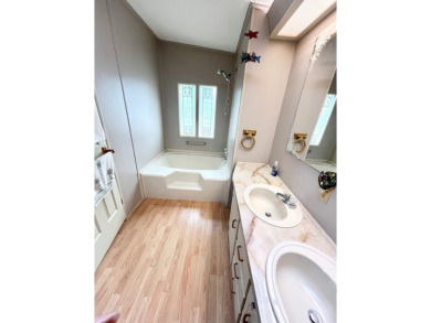 Looking for a well-maintained home in a vibrant gated golf on Pine Lakes Country Club in Florida - for sale on GolfHomes.com, golf home, golf lot