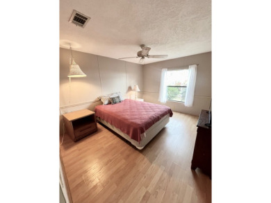 Looking for a well-maintained home in a vibrant gated golf on Pine Lakes Country Club in Florida - for sale on GolfHomes.com, golf home, golf lot