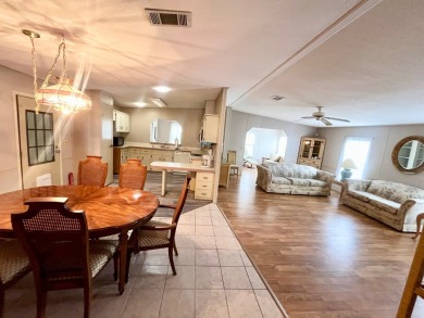 Looking for a well-maintained home in a vibrant gated golf on Pine Lakes Country Club in Florida - for sale on GolfHomes.com, golf home, golf lot