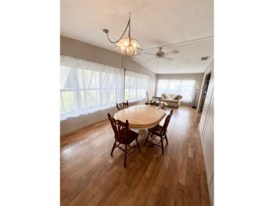 Looking for a well-maintained home in a vibrant gated golf on Pine Lakes Country Club in Florida - for sale on GolfHomes.com, golf home, golf lot