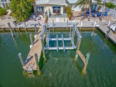 Dockage defines the lifestyle at this updated two-bedroom on Key Colony Beach Golf Course in Florida - for sale on GolfHomes.com, golf home, golf lot