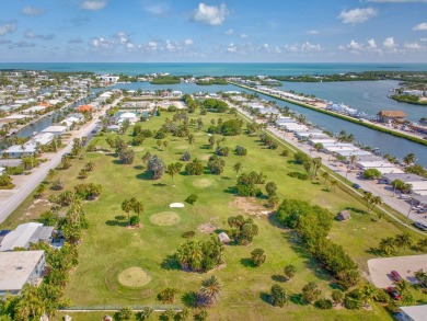 Dockage defines the lifestyle at this updated two-bedroom on Key Colony Beach Golf Course in Florida - for sale on GolfHomes.com, golf home, golf lot