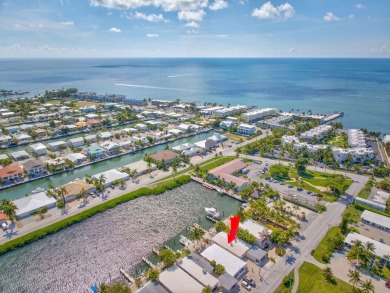 Dockage defines the lifestyle at this updated two-bedroom on Key Colony Beach Golf Course in Florida - for sale on GolfHomes.com, golf home, golf lot