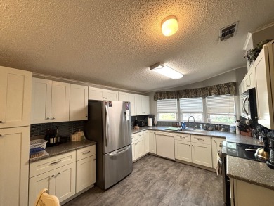This home is located within a 55 + resort style leased land on Big Cypress Golf and Country Club in Florida - for sale on GolfHomes.com, golf home, golf lot