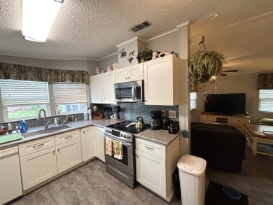 This home is located within a 55 + resort style leased land on Big Cypress Golf and Country Club in Florida - for sale on GolfHomes.com, golf home, golf lot