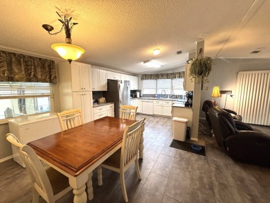 This home is located within a 55 + resort style leased land on Big Cypress Golf and Country Club in Florida - for sale on GolfHomes.com, golf home, golf lot