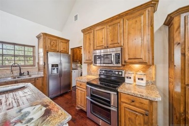 Welcome to this gorgeous home located in the sought after gated on The Coves Golf Course in Oklahoma - for sale on GolfHomes.com, golf home, golf lot