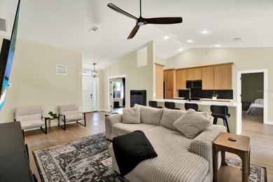 Wake up to panoramic water and fairway views from this fully on Links At Greenfield Plantation in Florida - for sale on GolfHomes.com, golf home, golf lot