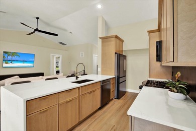 Wake up to panoramic water and fairway views from this fully on Links At Greenfield Plantation in Florida - for sale on GolfHomes.com, golf home, golf lot