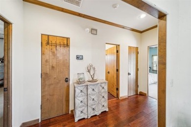 Welcome to this gorgeous home located in the sought after gated on The Coves Golf Course in Oklahoma - for sale on GolfHomes.com, golf home, golf lot