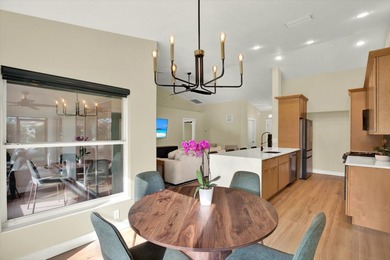 Wake up to panoramic water and fairway views from this fully on Links At Greenfield Plantation in Florida - for sale on GolfHomes.com, golf home, golf lot