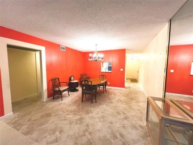 2nd FLOOR CORNER with WIDE GOLF/LAKE/POOL VIEW Plus HURRICANE on Wynmoor Golf Course in Florida - for sale on GolfHomes.com, golf home, golf lot