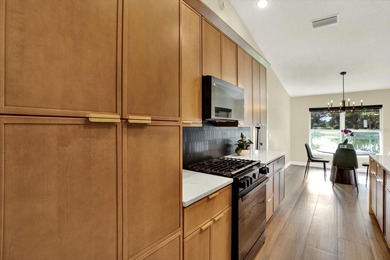 Wake up to panoramic water and fairway views from this fully on Links At Greenfield Plantation in Florida - for sale on GolfHomes.com, golf home, golf lot