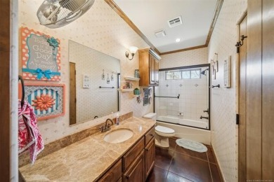 Welcome to this gorgeous home located in the sought after gated on The Coves Golf Course in Oklahoma - for sale on GolfHomes.com, golf home, golf lot